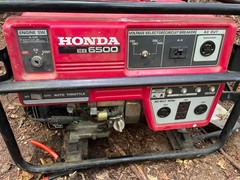 Red and black Honda eb6500x electric generator old but good condition